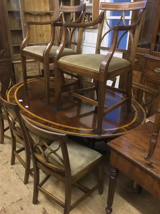 George III style oval dining table and 8 similar chairs with satinwood bending